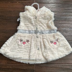 White fur vest